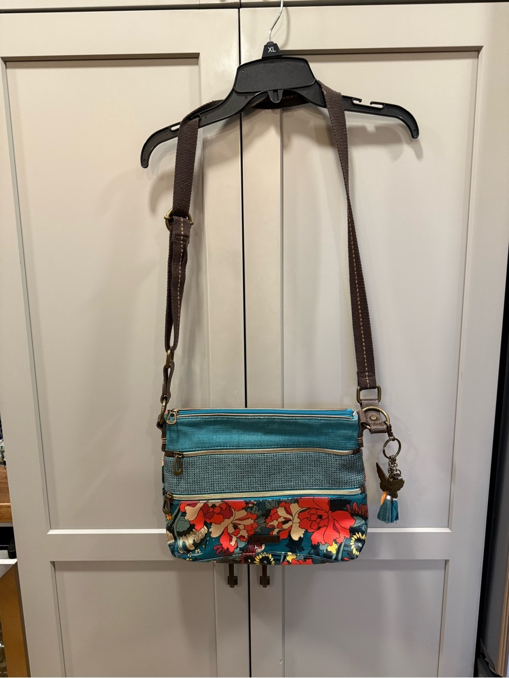 Sakroots Turquoise Floral Crossbody with Brown Strap and Tassel Charm